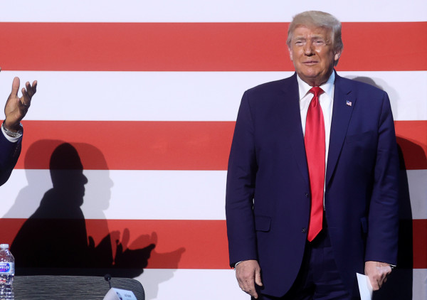 U.S. President Donald Trump is applauded as he attends a roundtable discussion with members of the faith community